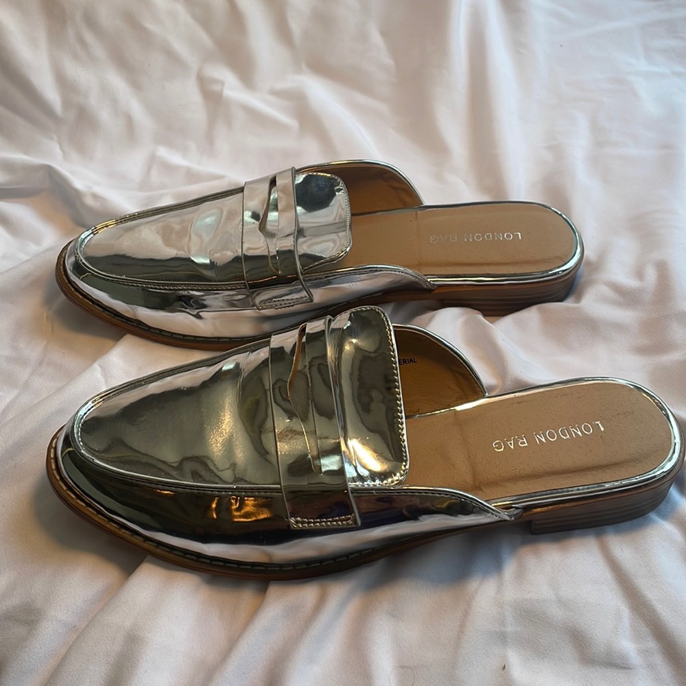 Never worn silver mules. Cute and comfortable, size 8.5.